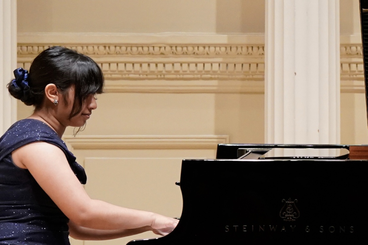 Dristi performing at the piano