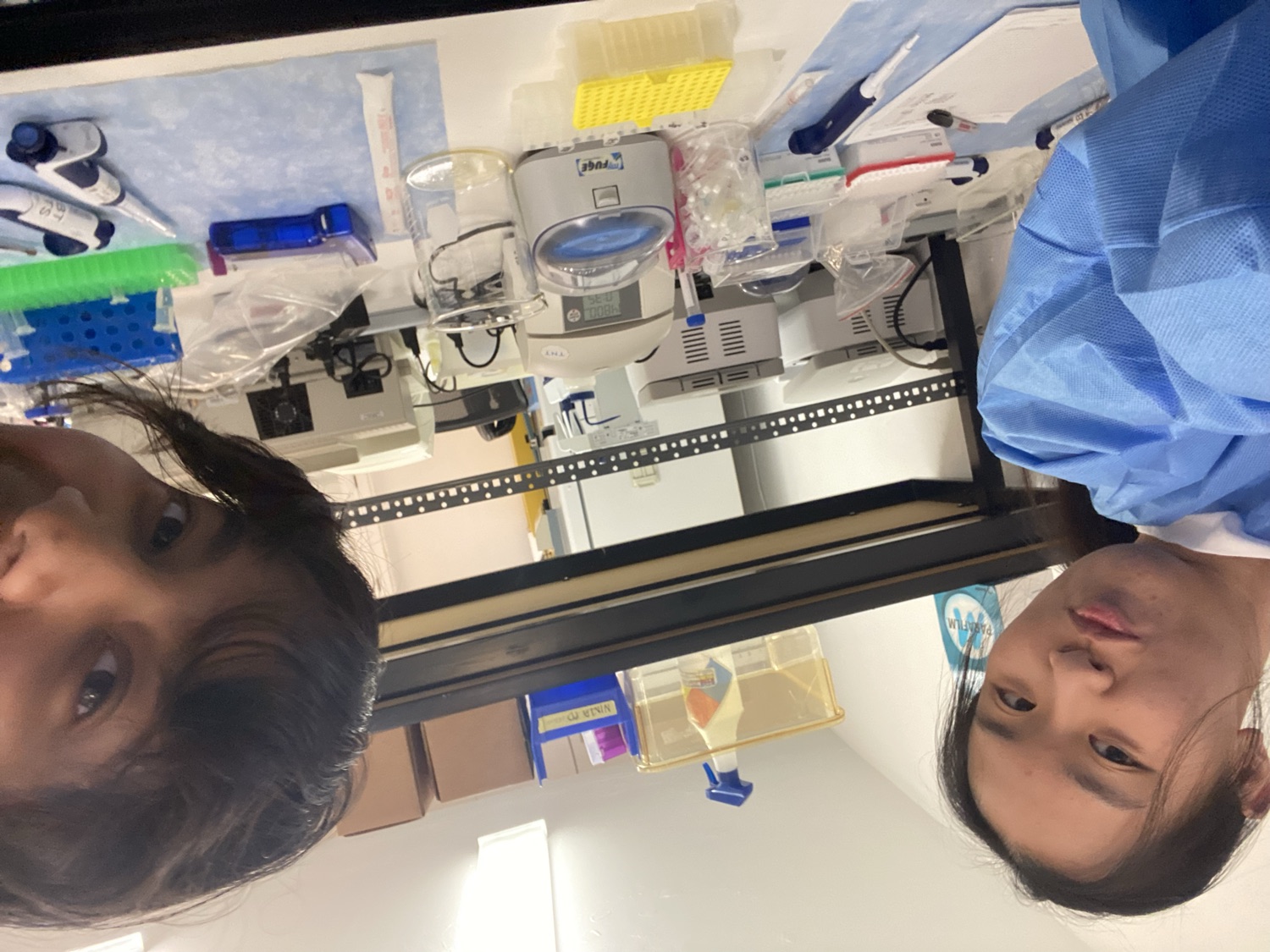 Dristi and a friend in a research lab